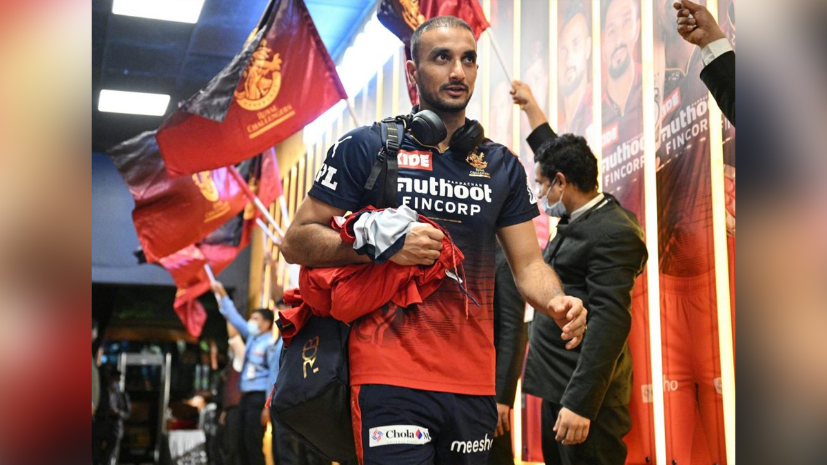 RCB bowler Harshal Patel indicates he should be fit for Eliminator vs Lucknow Super Giants Mumbai : Royal Challengers Bangalore's charismatic pace bowler Harshal Patel has indicated that he should be fit for the team's Eliminator game against Lucknow Super Giants at the Eden Garden in Kolkata on May 25, after suffering a split webbing in the game against Gujarat Titans at the Wankhede Stadium on May 19.The 31-year-old had copped a nasty cut on his right hand's webbing while fielding and it started bleeding profusely. Patel was quickly checked upon by RCB's physio and the pacer headed back to the dressing room to get the webbing stitched. The bowler did not take any further part in the match against Gujarat Titans as RCB went on to win by eight wickets. With RCB securing a playoffs berth after Mumbai Indians defeated Delhi Capitals to deny the Rishabh Pant-led side a last-four slot, Patel's importance to the Faf du Plessis-led side cannot be understated.He was the Purple Cap winner in IPL 2021, picking up 32 wickets in 15 matches and this season Patel has a total of 18 scalps from 13 games. He is on the threshold of a century of IPL wickets. More than the wickets, he has been extremely economical in his spells (7.68) and requires just four scalps to make it 100 IPL wickets.Disclosing how he suffered the injury, Patel told RCB that, "When I caught that ball on short extra cover, I split my webbing on the right hand. I got a couple of stitches which should come off in three to four days... I think I will be ready to be a part of it (Eliminator)."Patel disguising his variations beautifully is the reason why the RCB pace bowler has been performing so well in the last couple of IPL season, and he got the seal of approval from none other than Sachin Tendulkar.Speaking on his Youtube channel recently, the legend had labelled Patel as one of the most potent bowlers in the death overs."I think that he is one of the leading bowlers in the country when it comes to bowling in the death overs," Tendulkar opined recently. ipl, cricket Sports News, Cricket, Cricketer, Player, Bowler, Batsman, Indian Premier League, IPL, IPL 2022, #IPL2022, Harshal Patel, Royal Challengers Bangalore, Lucknow Super Giants